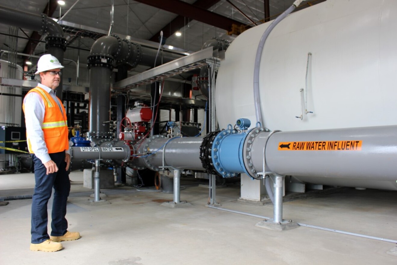 AR's operations manager, Ron Halsey, stands in front of the intake pipe that siphons water originating indirectly from the Berkeley Pit into this new water polishing plant. August 6, 2019.